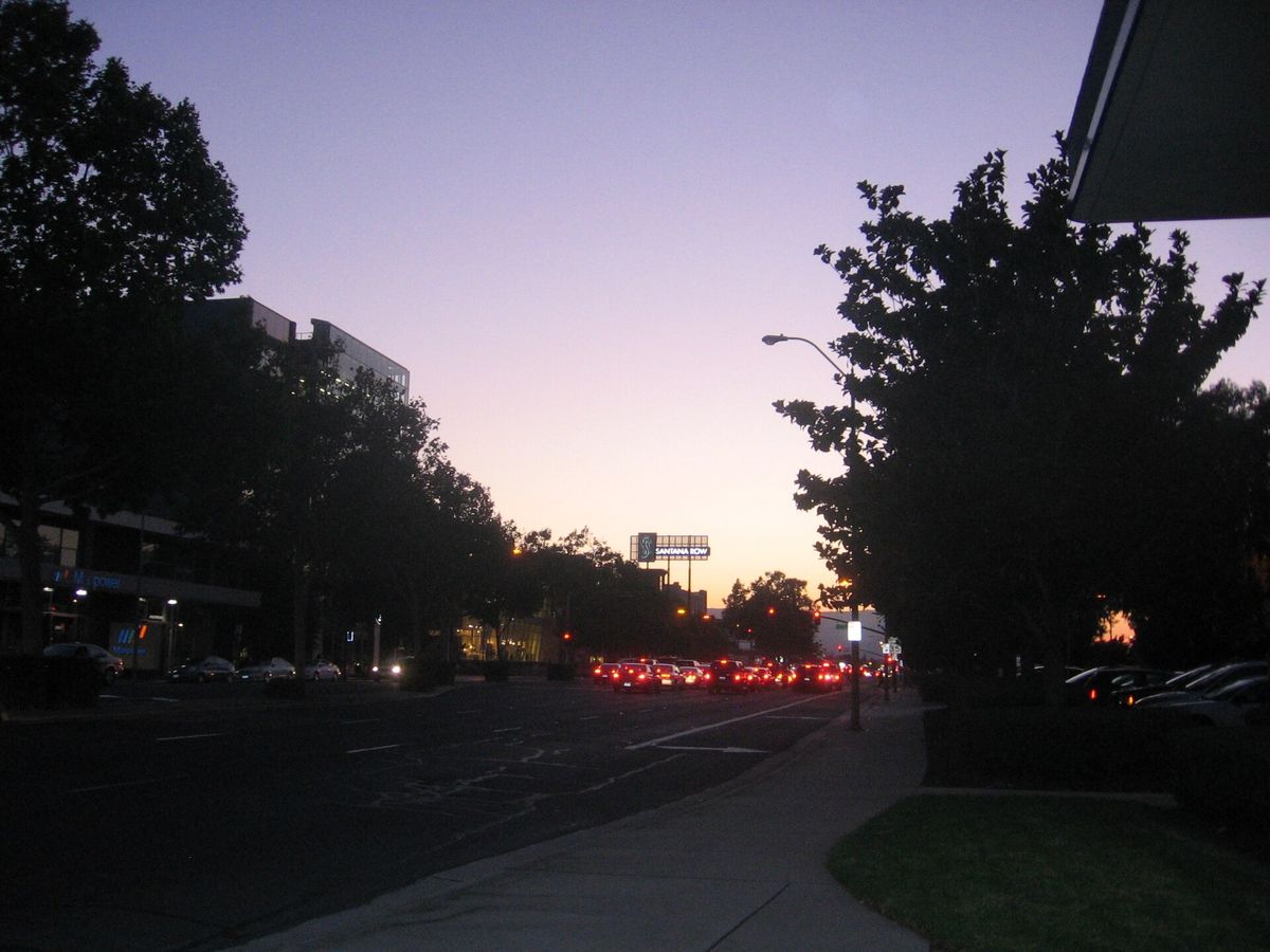 Dusk over the tree-lined boulevard between Valley Fair and Santana Row