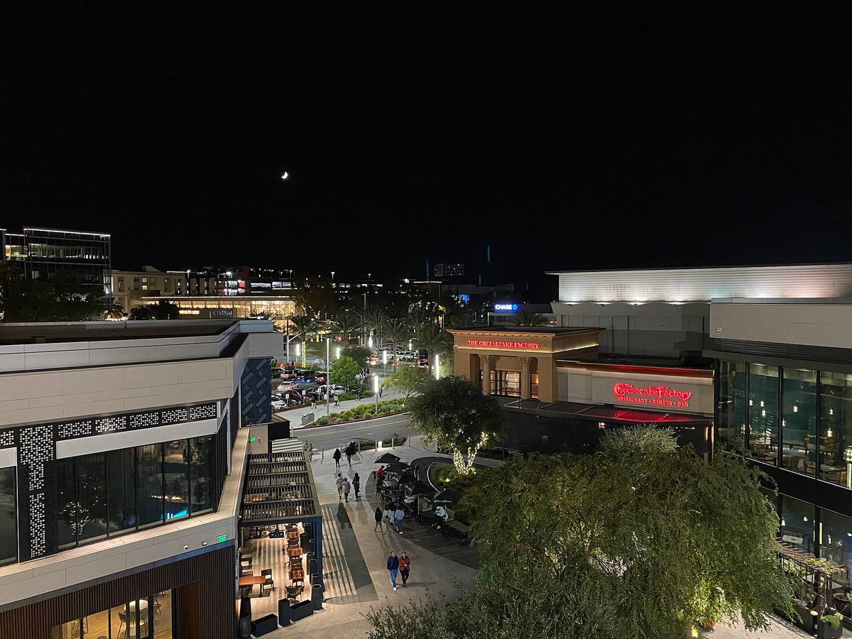 Valley Fair's terraces and parking lit up at night