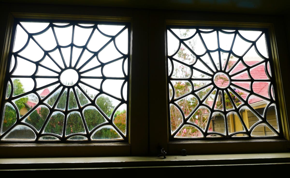 Two windows with spider-web tracery in the Winchester Mystery House